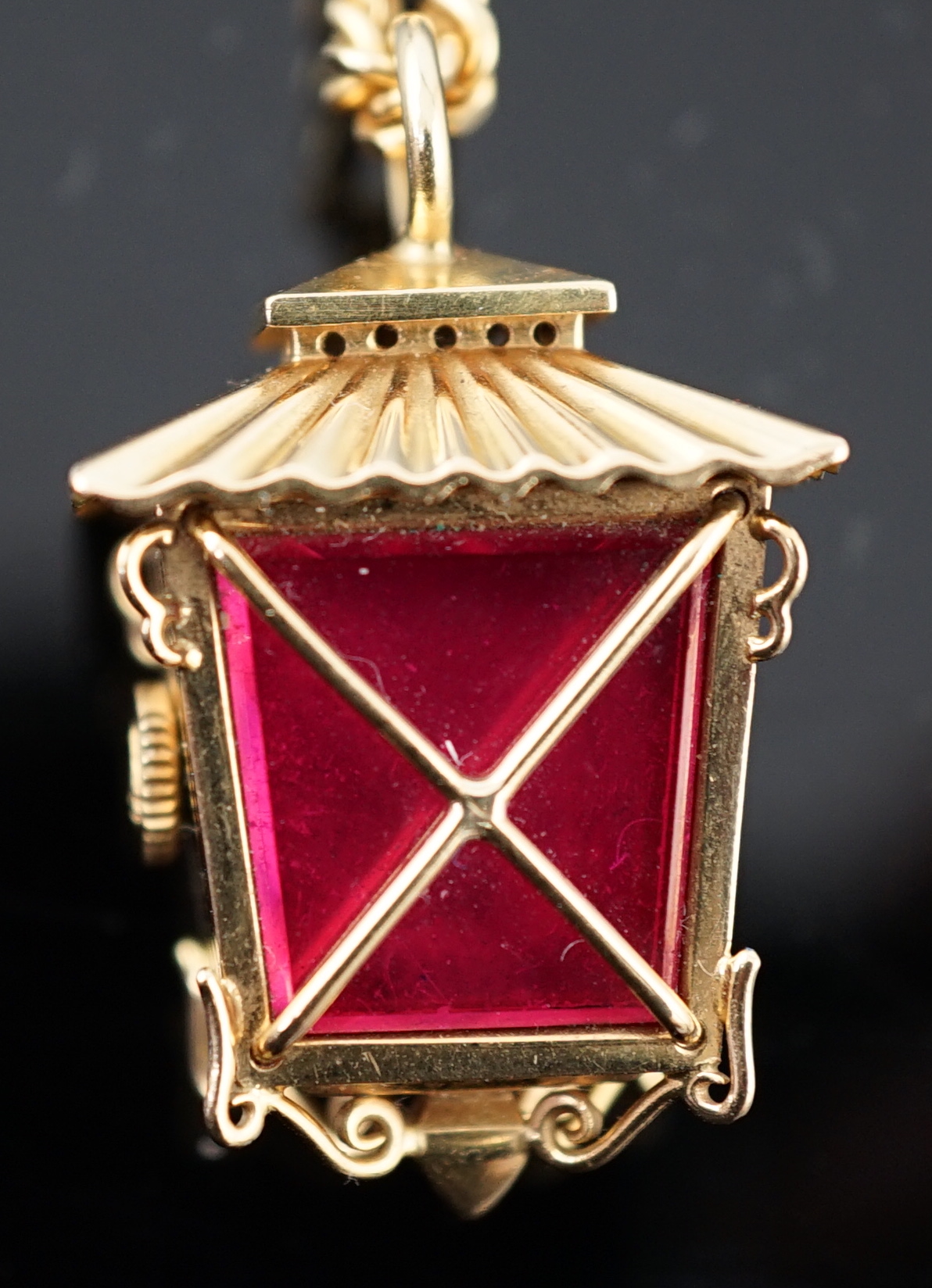 A lady's novelty gold Rolex pendant fob watch, modelled as a lantern, with baton numerals, together with an 18ct gold chain